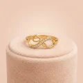 22k gold infinity ring, stone studded gold ring, infinity heart jewelry, minimalist stone ring, OVJ JEWELS, premium gold rings for women, handcrafted gold jewelry, worldwide shipping jewelry