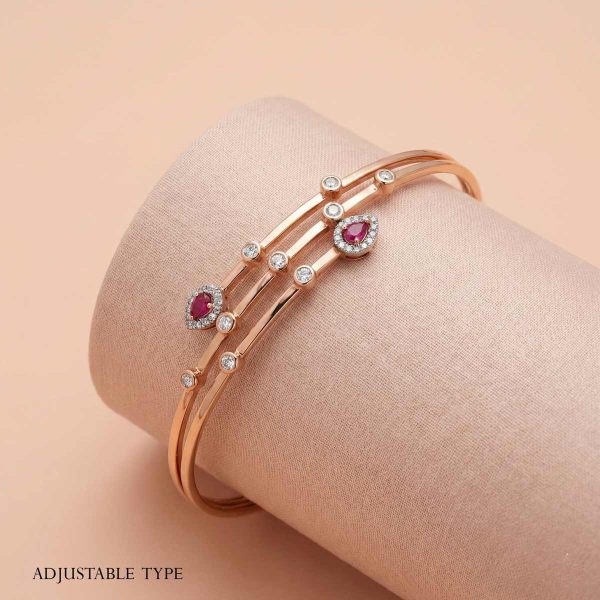 "18k rose gold adjustable minimalist bracelet with pear-shaped rubies and diamonds by OVJ Jewels"