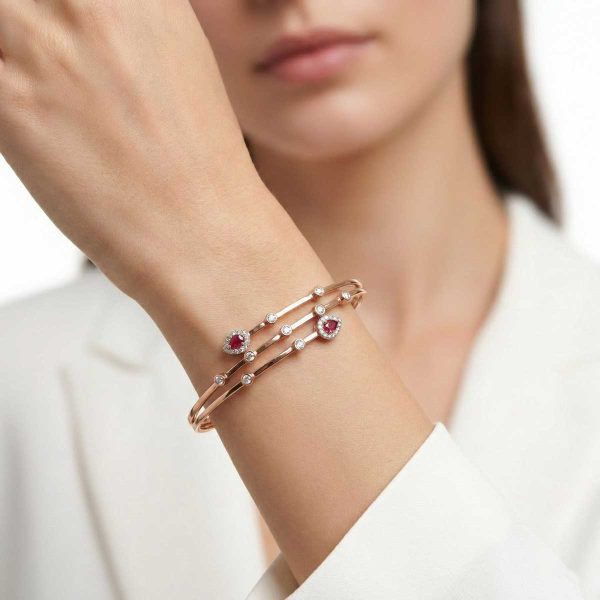 "18k rose gold adjustable minimalist bracelet with pear-shaped rubies and diamonds by OVJ Jewels"