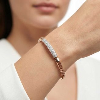 18k rose gold minimalist bracelet with diamond pave bar and geometric lattice band by OVJ Jewels.