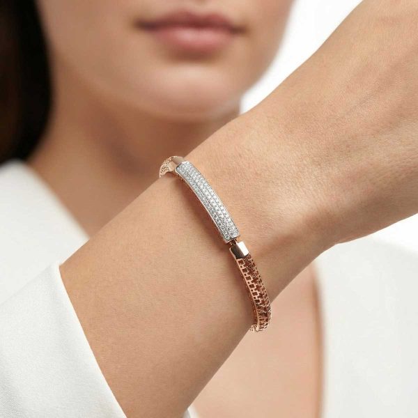 18k rose gold minimalist bracelet with diamond pave bar and geometric lattice band by OVJ Jewels.