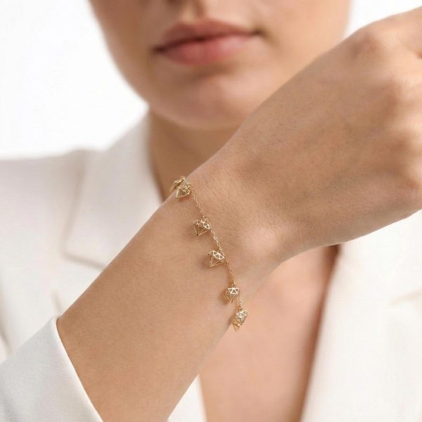 18k gold bracelet, minimalist jewelry, dainty gold charm bracelet, geometric gold jewelry, 18k yellow gold, OVJ Jewels, minimalist gold bracelet for women, diamond cut gold charms, 7 inch gold bracelet, modern gold jewellery.