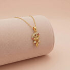 22k gold pendant, floral gold pendant, flower pendant gold, designer gold pendant, stone pendant design, ladies gold pendant, gold pendant for women, ruby stone pendant, cz stone pendant, elegant gold jewelry, lightweight gold pendant, luxury gold pendant, trendy pendant design,