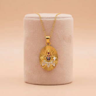 Enhance your jewellery collection with this stunning 22K gold temple pendant featuring a radiant oval design, CZ stones, and traditional Balaji detailing. Lightweight, stylish, and perfect for gifting or festive wear. Available now at OVJ Jewels.