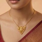 22k gold Lakshmi pendant, gold temple pendant, Lakshmi pendant design, traditional gold pendant, ruby stone pendant, South Indian jewelry, temple jewelry pendant, antique gold pendant, bridal gold pendant, goddess Lakshmi jewelry, women's gold pendant, pure gold pendant, festive jewelry, wedding gold pendant, designer gold pendant