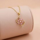 22k gold pendant, floral gold pendant, pink stone pendant, ladies gold pendant, trendy gold pendant, flower pendant design, cz gold pendant, lightweight gold pendant, stylish pendant for women, diamond finish pendant, elegant gold jewellery,